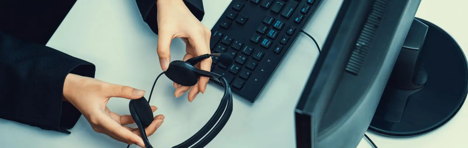 Customer support representative preparing a headset